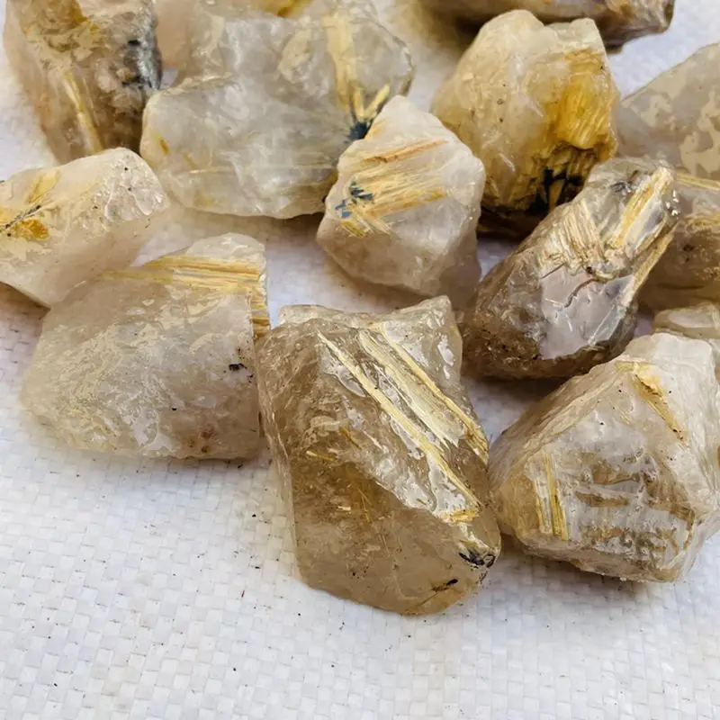 Редкий оптовая продажа натуральные золотые волосы рутилированные кварцевые необработанные кристаллы необработанный турмалиновый камень для продажи