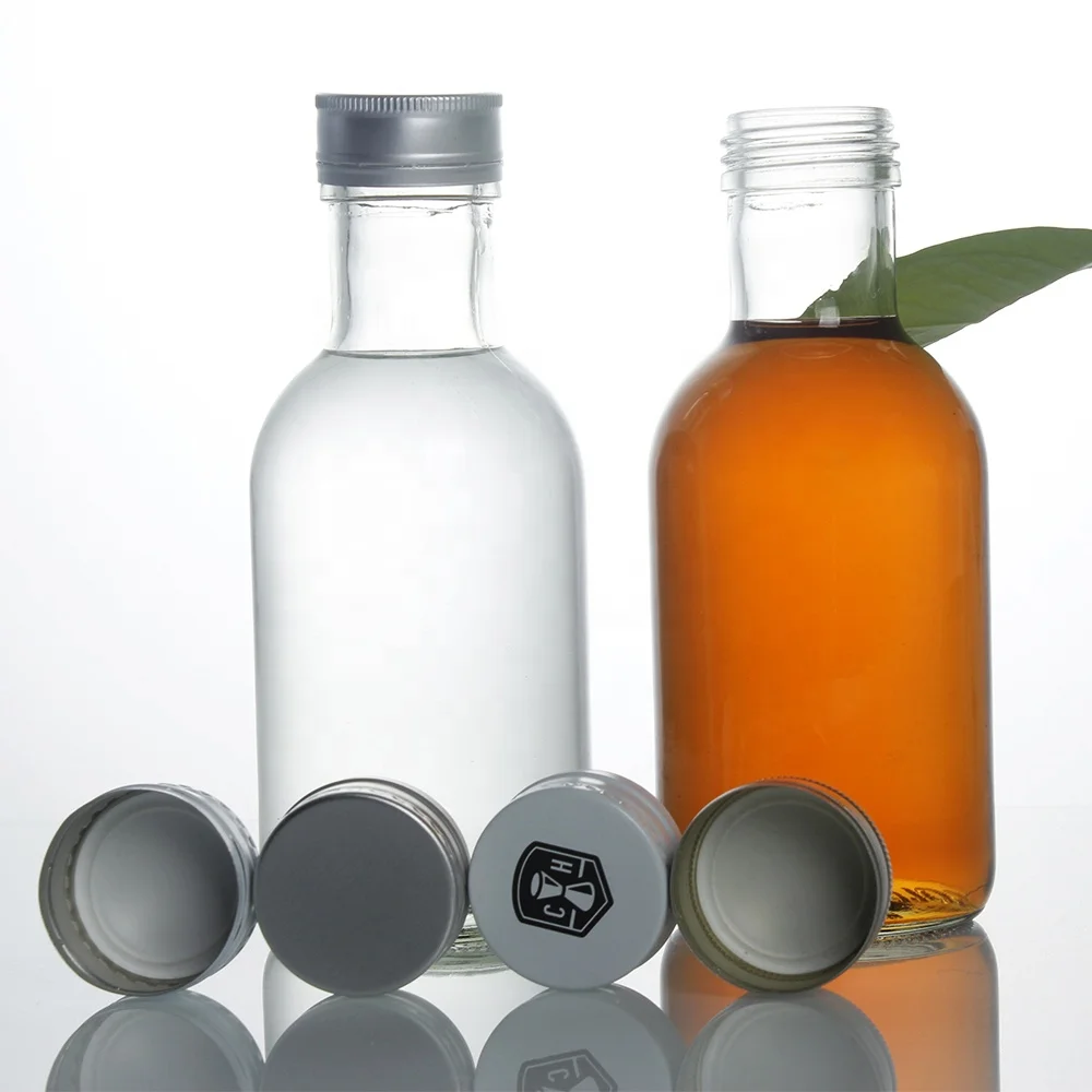 Stocked round clear empty 350ml glass bottle for beverage drinks 120oz fruit juice glass bottle