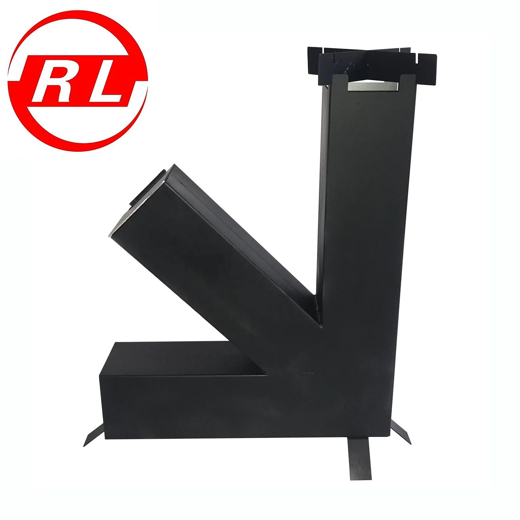 Stainless Steel Rocket Stove Loaded With Split Wood In The Vertical Chamber