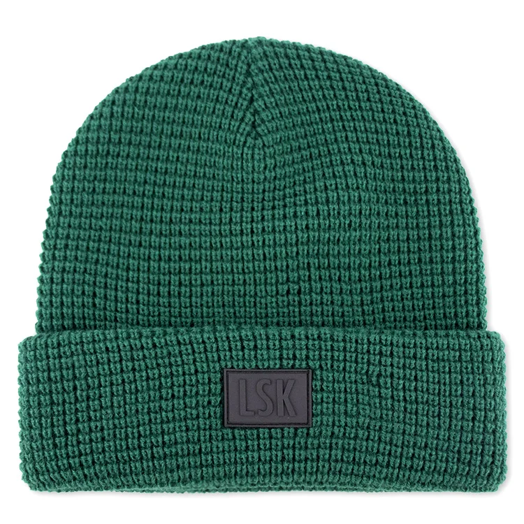 Hengxing solid green color custom pvc rubber patch skull cap soft cuffed winter warm hat waffle knit beanie manufacturer