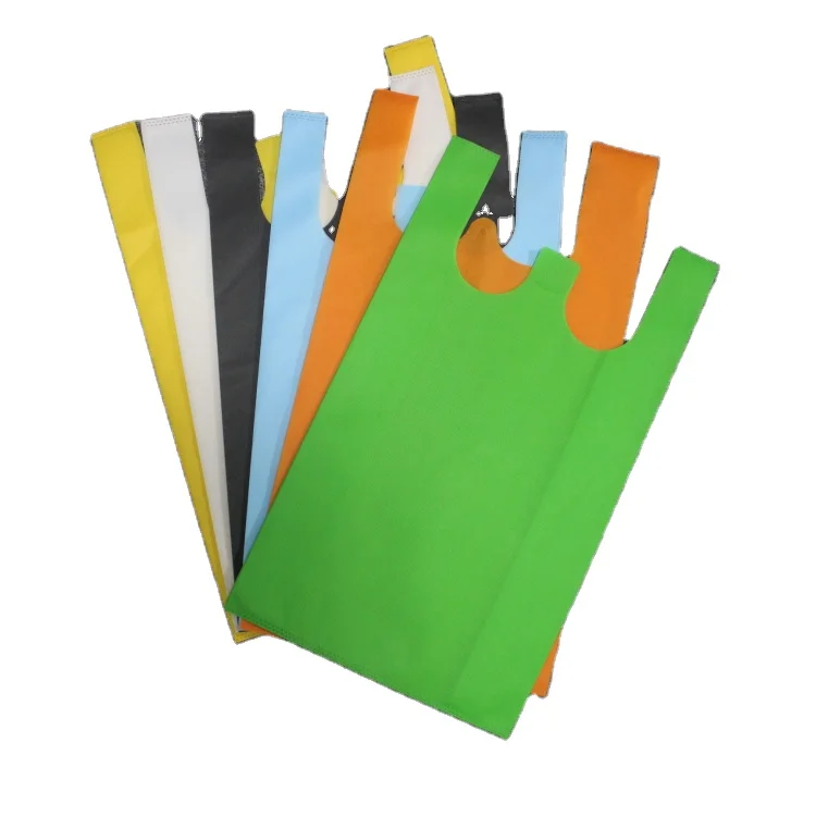 Wholesale non woven raw material fabric t-shirt bag shopping bag
