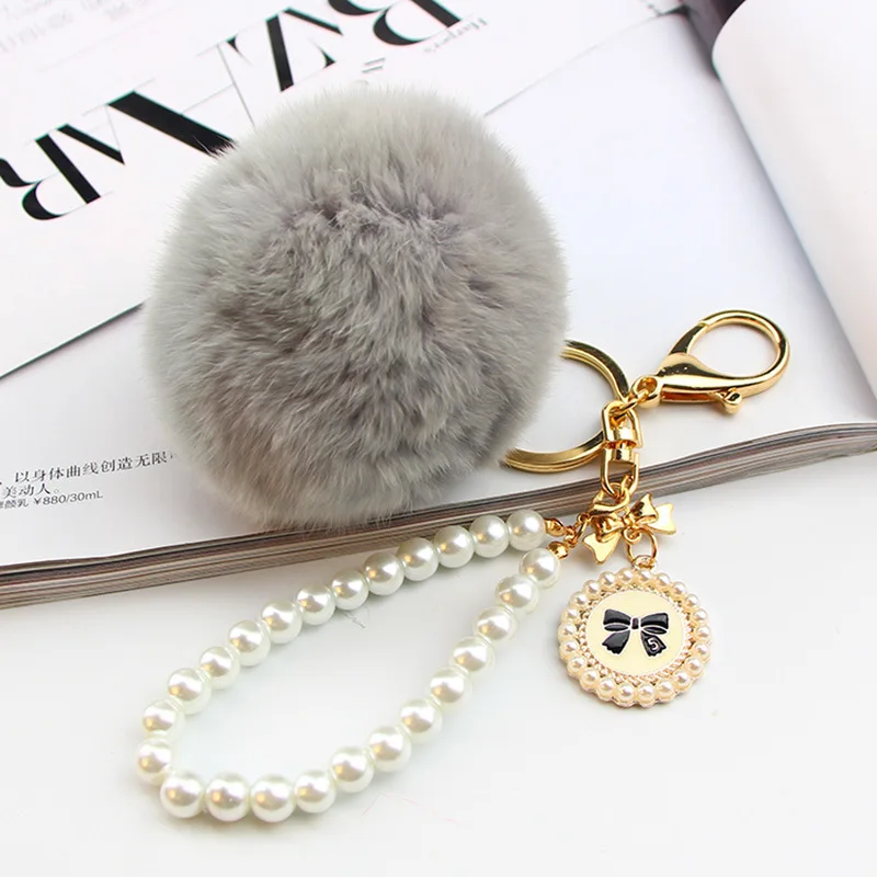 2022 Hot Sale Cheap Promotional Pearl Chain Charm Fluffy Cute 8cm Faux Fur  Key houlde Pompon Fur Ball Pom Keychain