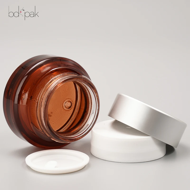 Wholesale ECO Friendly Reusable Jar for cream 1oz 2oz 30g 50g 100g Atter Shoulder UV Frosted Brown Clear Glass Cosmetics Jar 20g