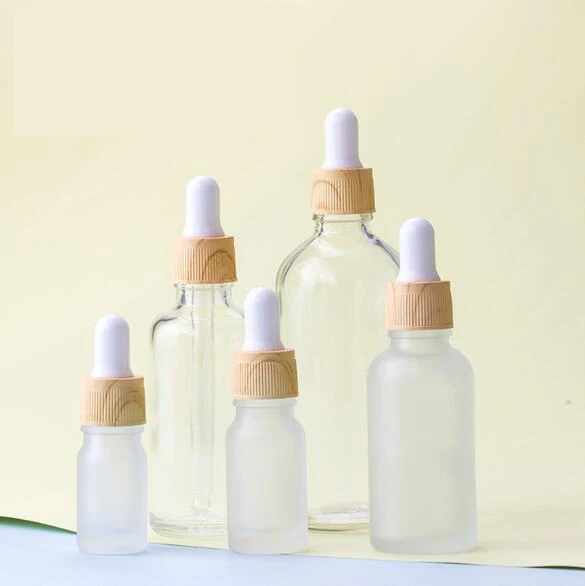 
cosmetic glass essential oil bottles 5 10 15 20 ml 30ml 50 100 ml frosted glass bottle water transfer wood grain dropper 