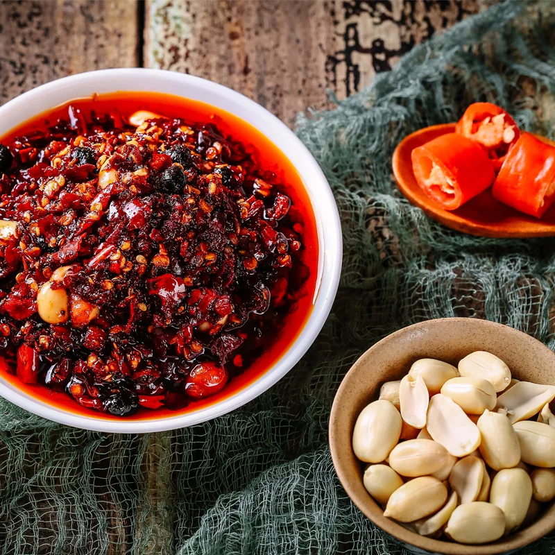 A spoonful of Sichuan flavor mixed with vegetables and noodles tastes good spices and seasonings Oil pepper