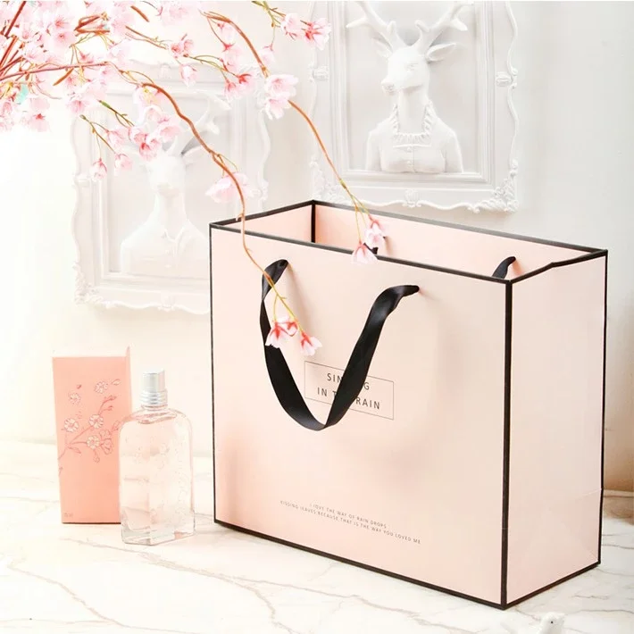 Free Design Custom Logo Matt Pink Paper Clothing Packaging Gift Paper Bag Shopping Bag Luxury Paper Bags With Ribbon Handle