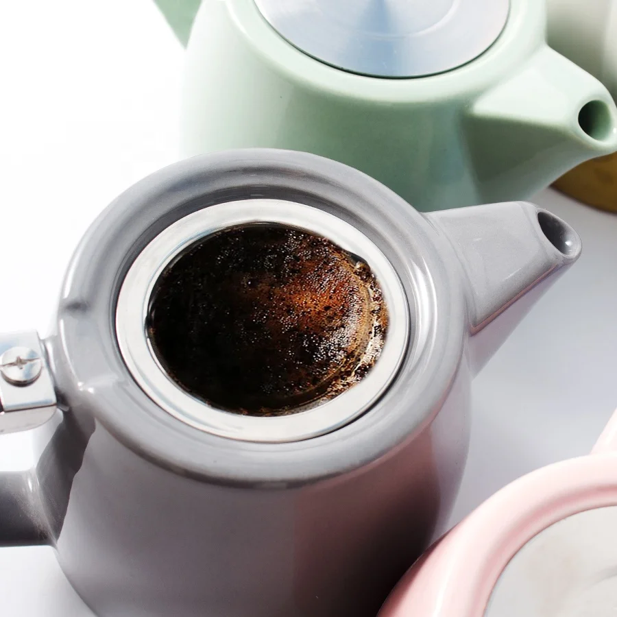 Wholesale custom ceramic teapot stainless steel lid and infuser porcelain tea pot with infuser