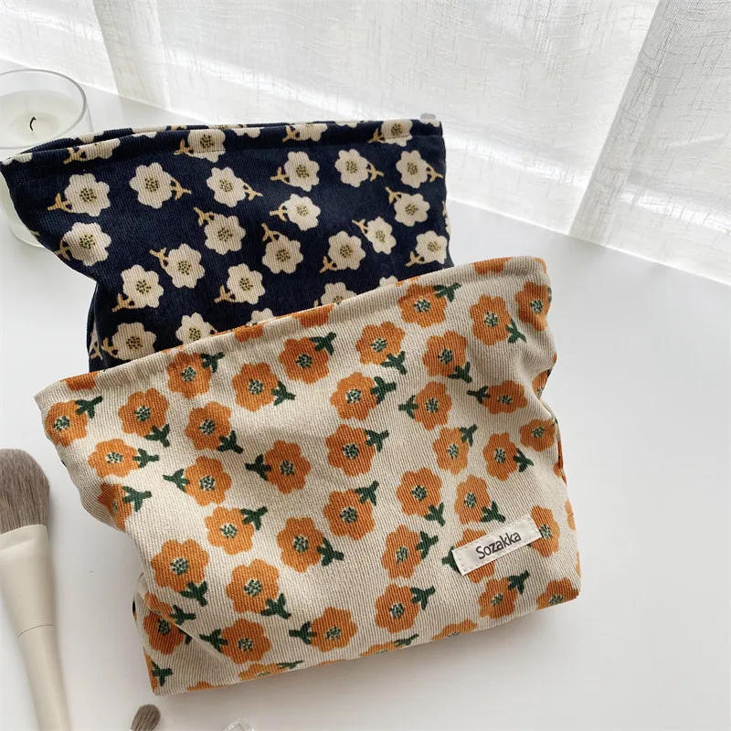 Corduroy plum blossom cosmetic bag will hand in hand with coin purse female Japanese literary storage bag.
