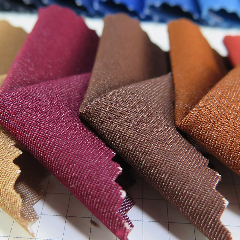 Оптовая продажа, тканый простой стиль, имитация джинсовой ткани 40S, 57% полиэстер, 40% вискоза, 3% спандекс, смешанная ткань для платья, брюк, куртки и т. Д.