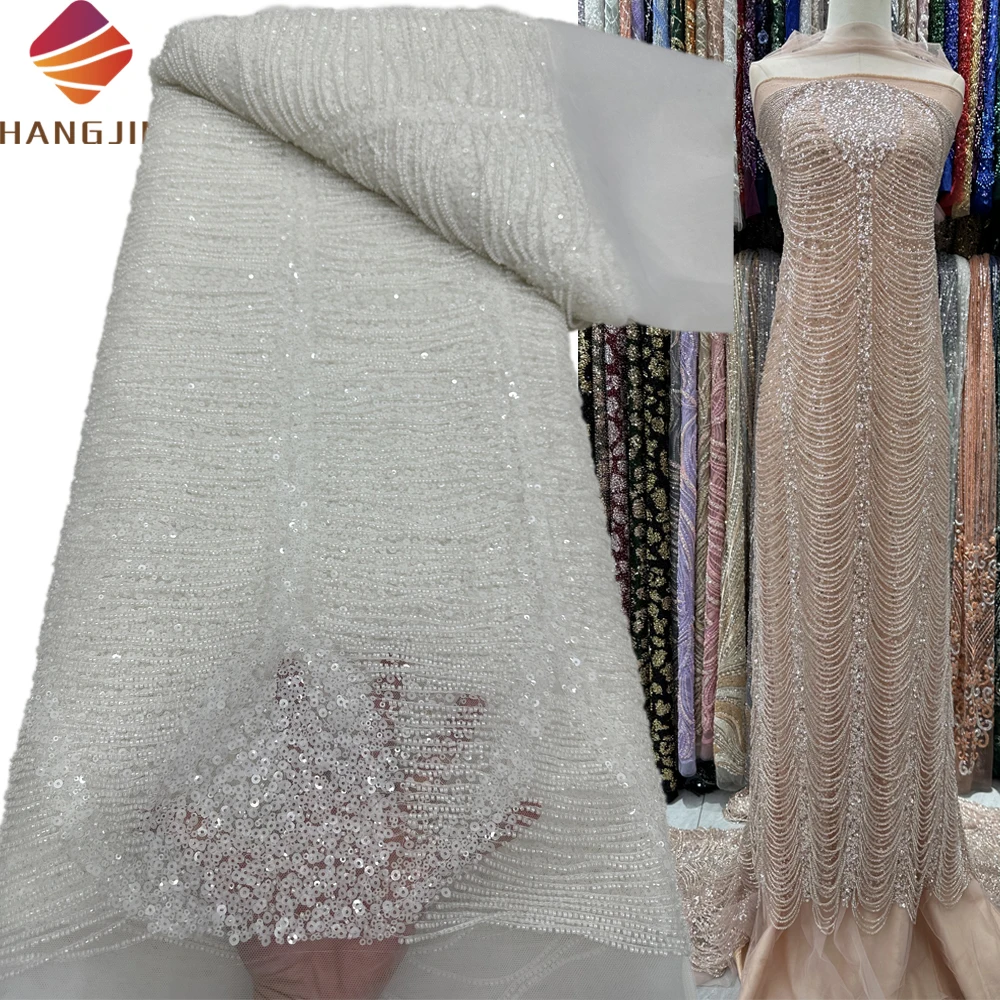 Wholesale Luxury Tassel Bridal Embroidery White Heavily Beaded Lace Fabric Wedding Dress Sequin Embroidery French Tulle Lace