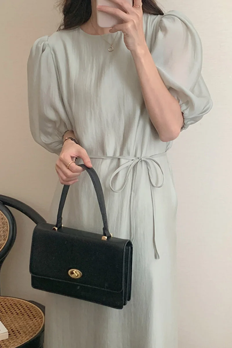 Wholesale 2023 South Korea Soft Green Round Neck Hollow-out Backless Lace Up Waist Solid Color Bubble Sleeve Dress