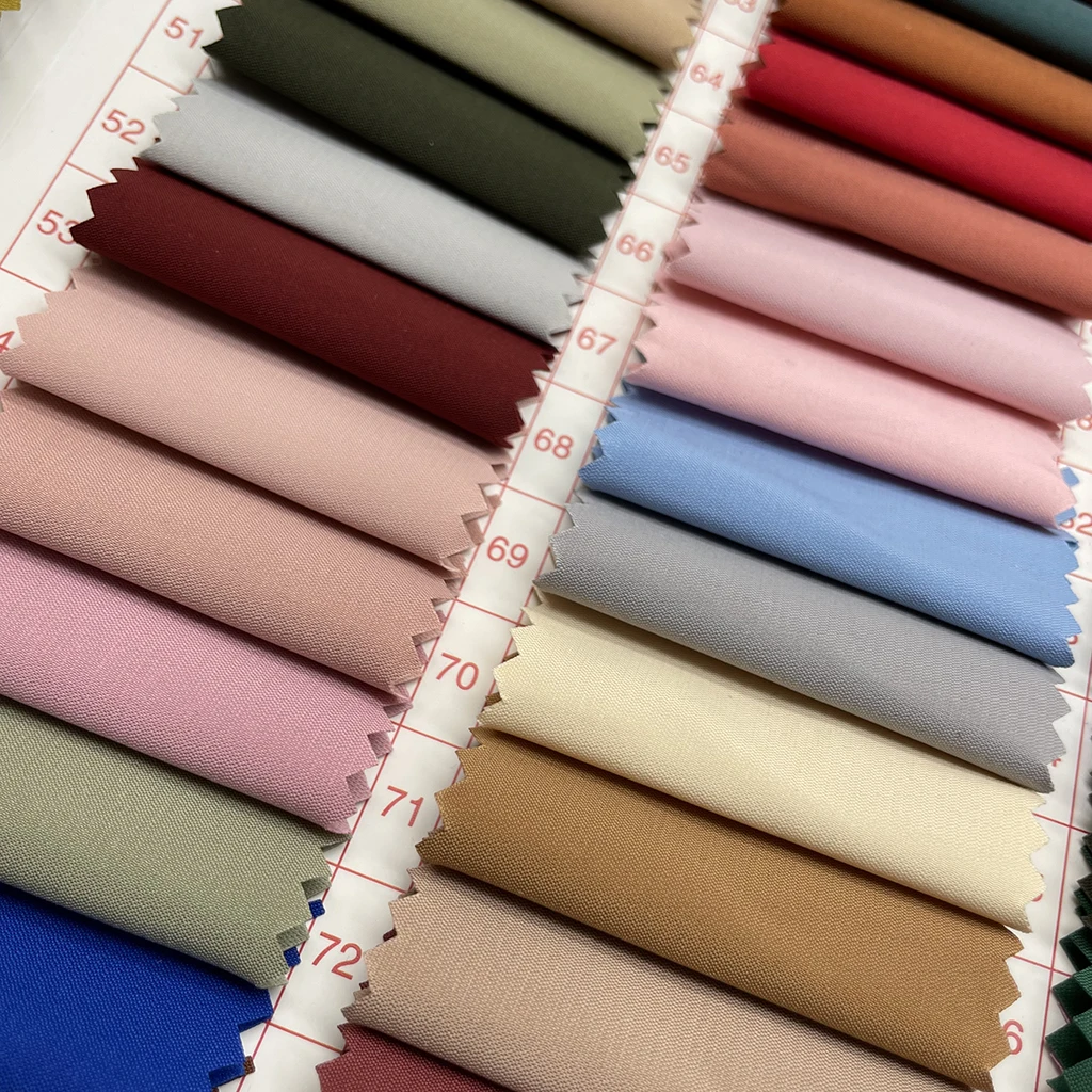 Hot selling woven solid colorful spandex broken twill polyester elastic buckling dyed stock fabric for jacket, coat