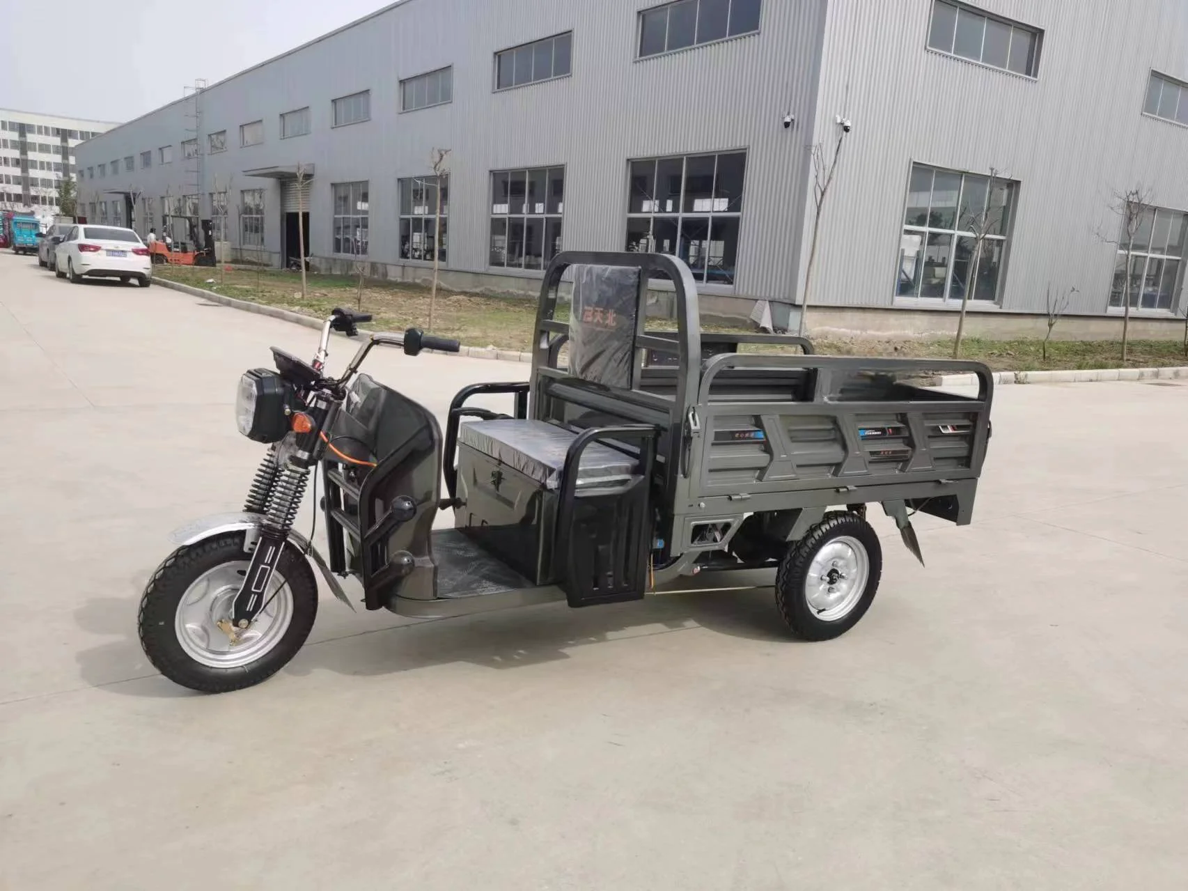 Two Chinese three wheeled electric freight vehicles electric tricycles tuk tuk tricycles delivery tricycles