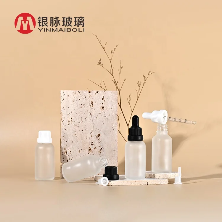 Wholesale 5ml 10ml 15ml 20ml 30ml 50ml 100ml clear frosted amber essential oil glass dropper bottle with paper tube