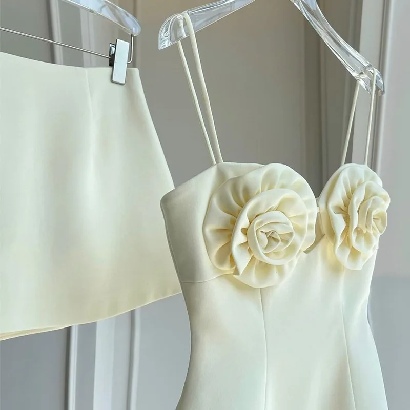 2024 Summer Fashion Design Sense Of Quality White Three Dimensional Flower Sling Top And Mini Skirt 2 Piece Set