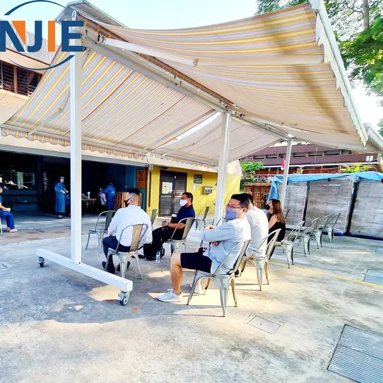 Wholesale price customized outdoor electric movable double sides retractable folding arm awning with wheel