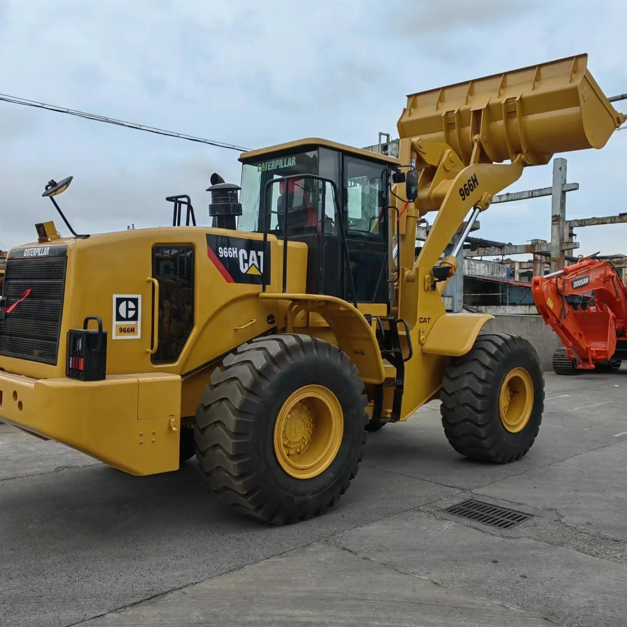 Caterpillar фронтальный погрузчик CAT 966H для продажи подержанный