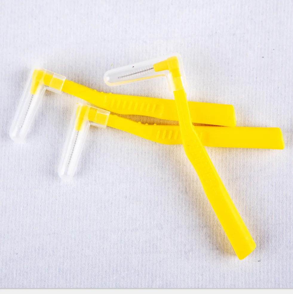 High quality new L-shaped orthodontic toothbrush for gum care.