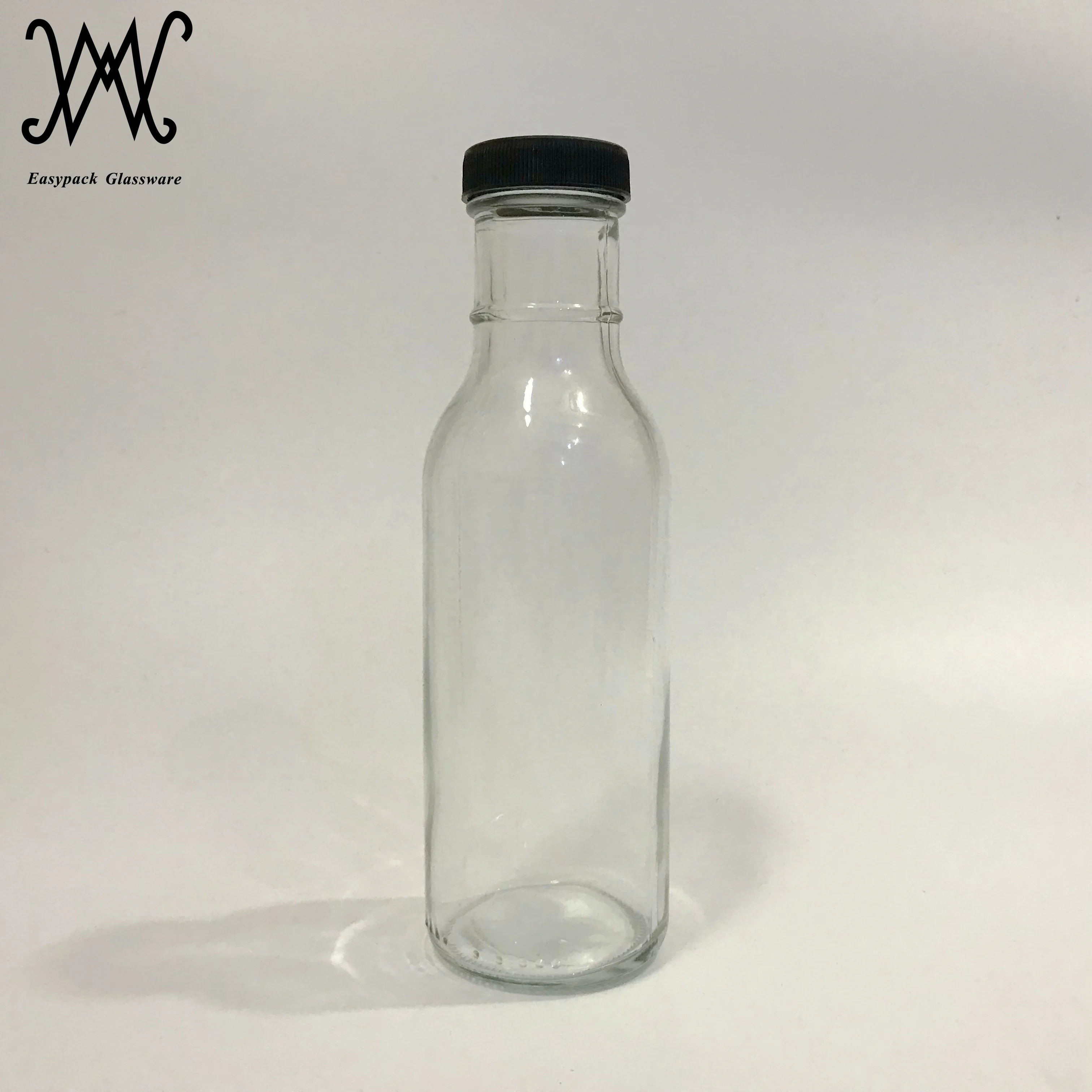 12 oz clear glass woozy tomato hot sauce spice bottle with black plastic cap