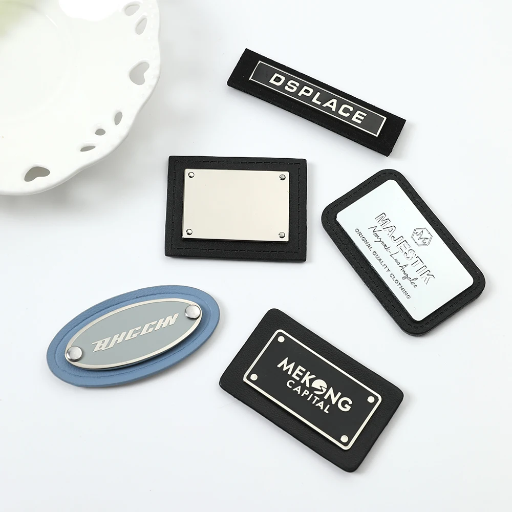 2024 good supplier metal logo labels with leather sewing label For Clothing Garment Metal Accessories