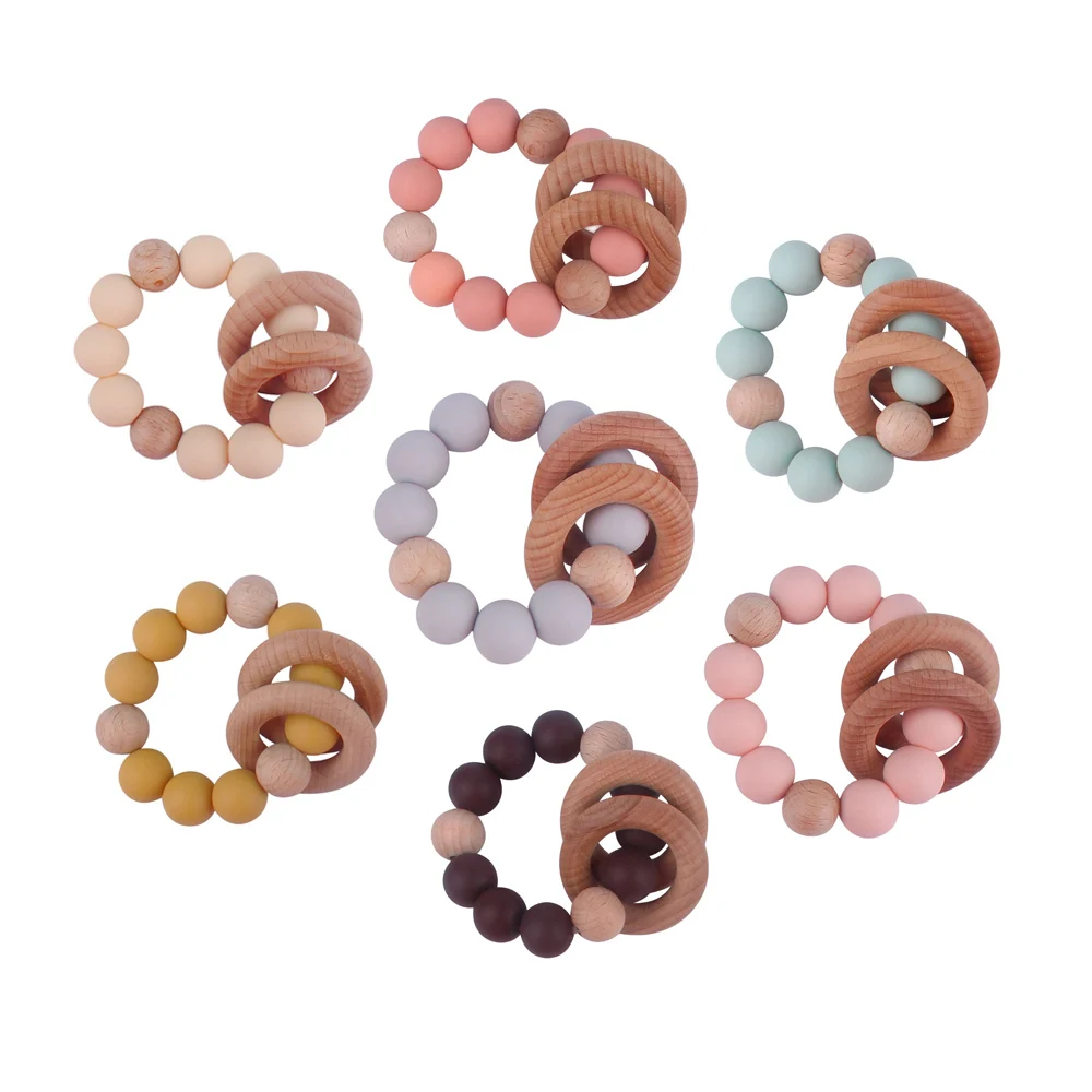Hot Sell Newborn Silicone Beads Diy Baby Silicone Rattle Wrist Ball Teether Ring Beech Wooden Teething Ring Toys Bebe Gift