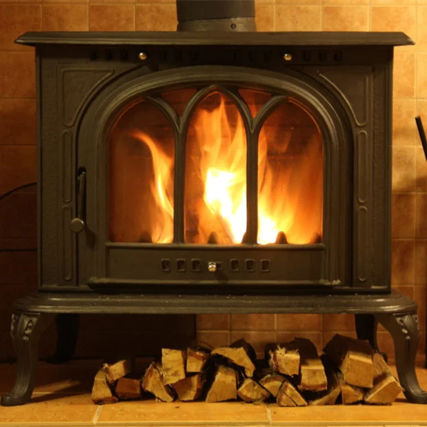 Modern style Firewood Hanging Freestanding Wood Burning Cast Iron Cooking Wood Pellet Stove Fireplace in winter