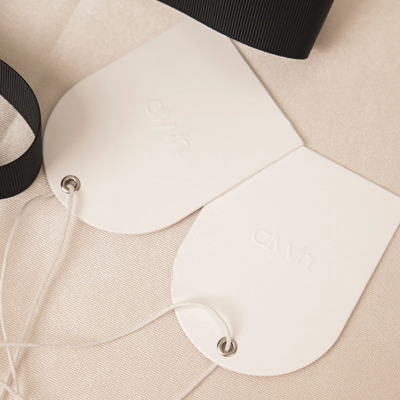 custom embossed logo metal eyelet hangtag paper swing tag arch shape tag with string