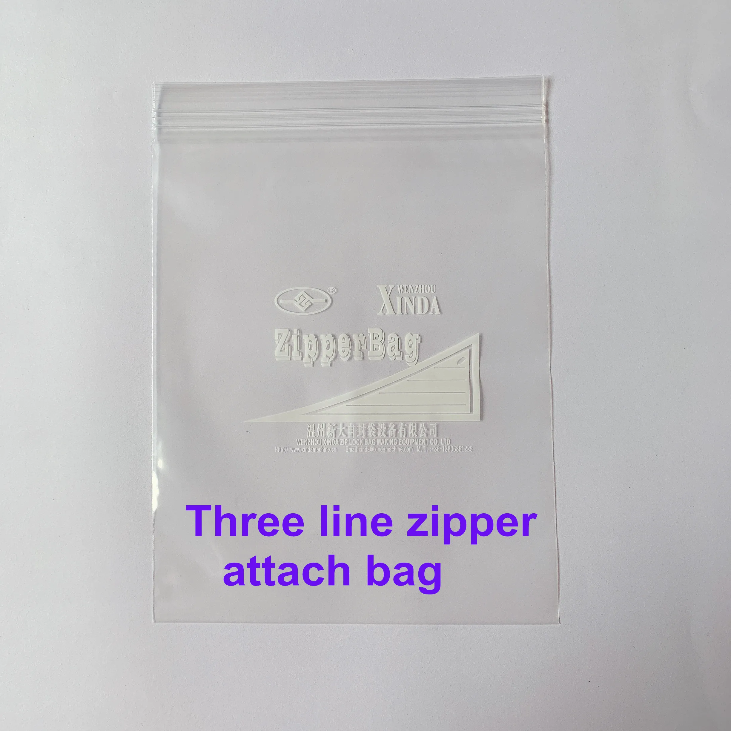 Zipper bag making machine with zipper attachment & auto hanger device cut on the rubber roller