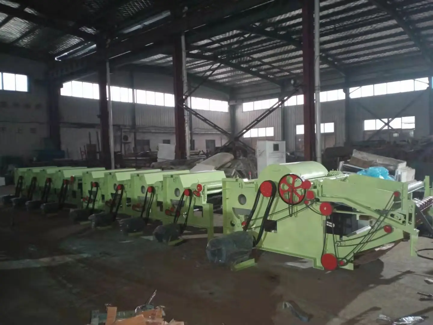 Textile waste old clothes jeans mattress scraps are recycled and opened into fibers textile recycling machine line