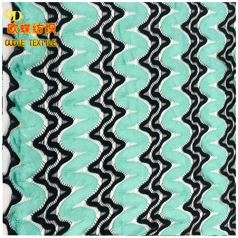 The manufacturer directly provides polyester yarn dyed blended polyester bright silk mesh knitted clothing fabric