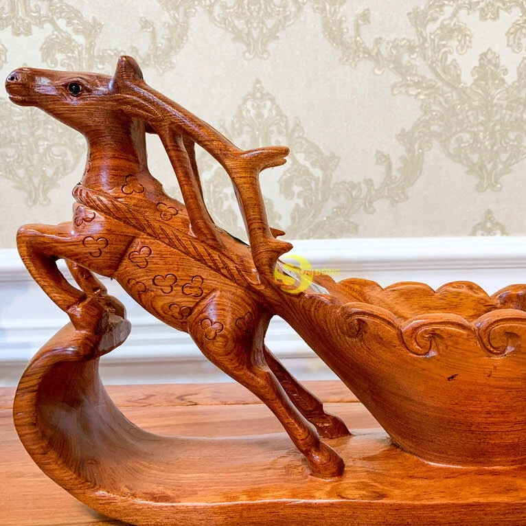 Reindeer pull cart carrying bottles of wine