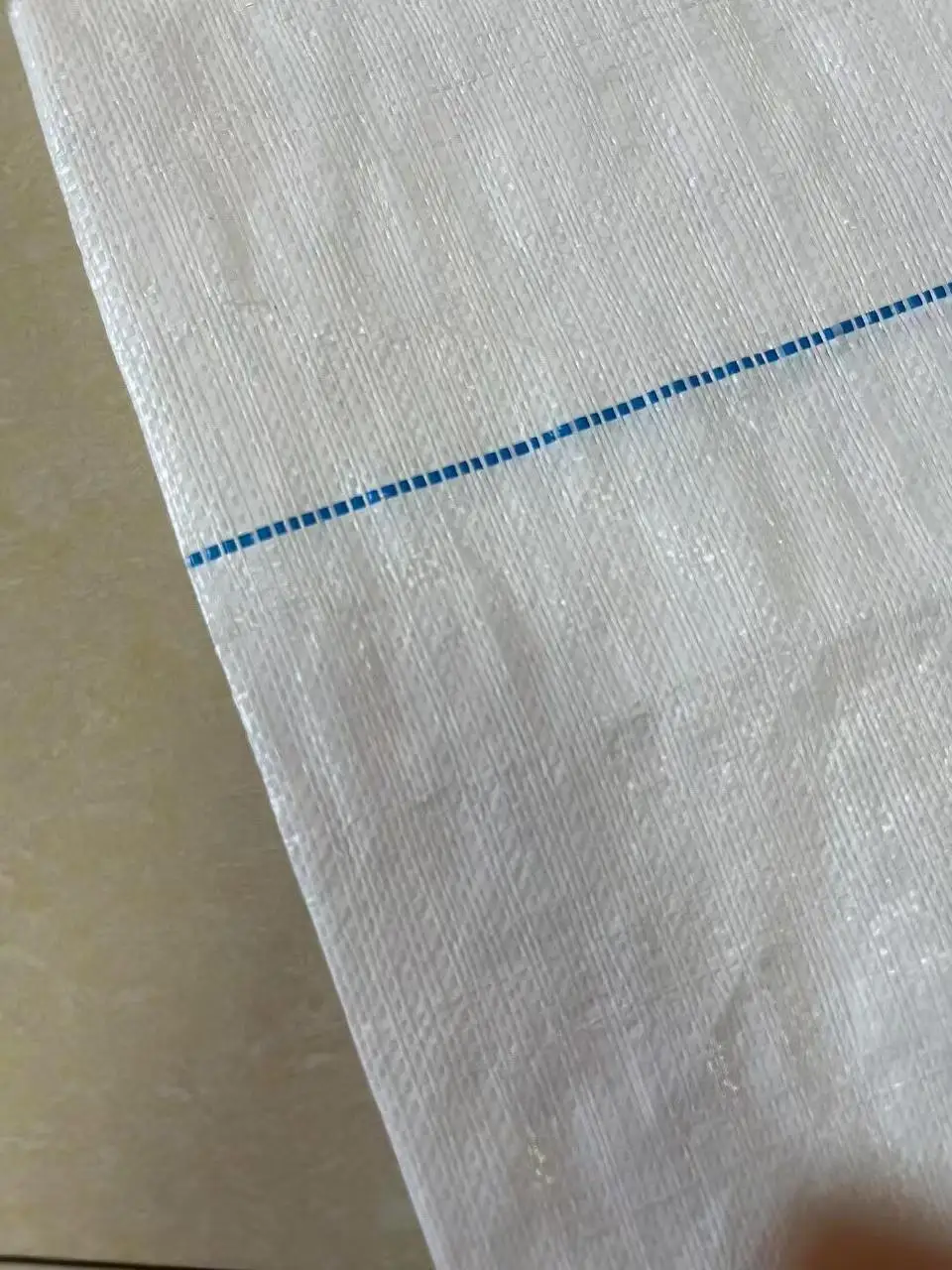 As customized Perforable and Sliceable Hot Sell Weed Mat PE Plastic Weed White Mat Fabric Cloth Weed Barrier   Ground Cover