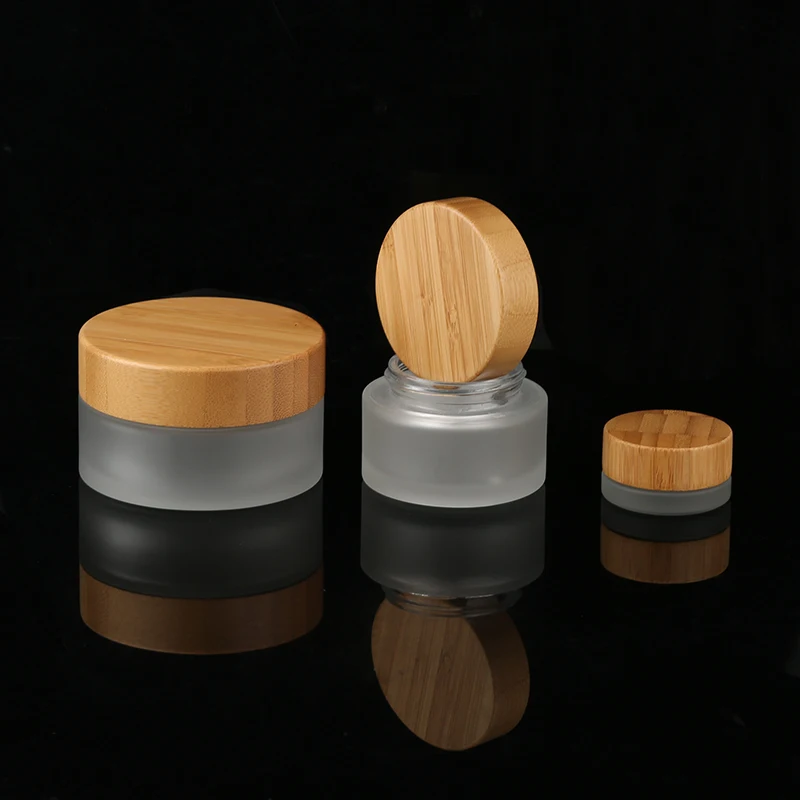 Natural Factory Direct Custom 100g empty round cream glass jar clear frosted bamboo glass cosmetic jars with bamboo lids