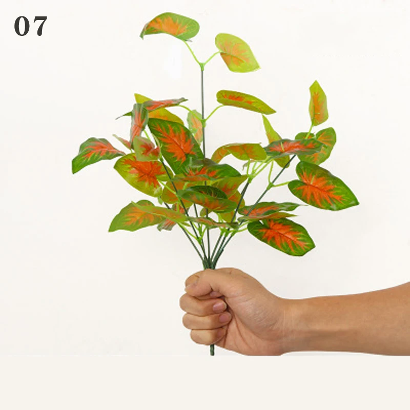 
2021 Artificial plant background wall plastic potted flower arrangement leaves wedding road guide fake flower plant pepper grass 