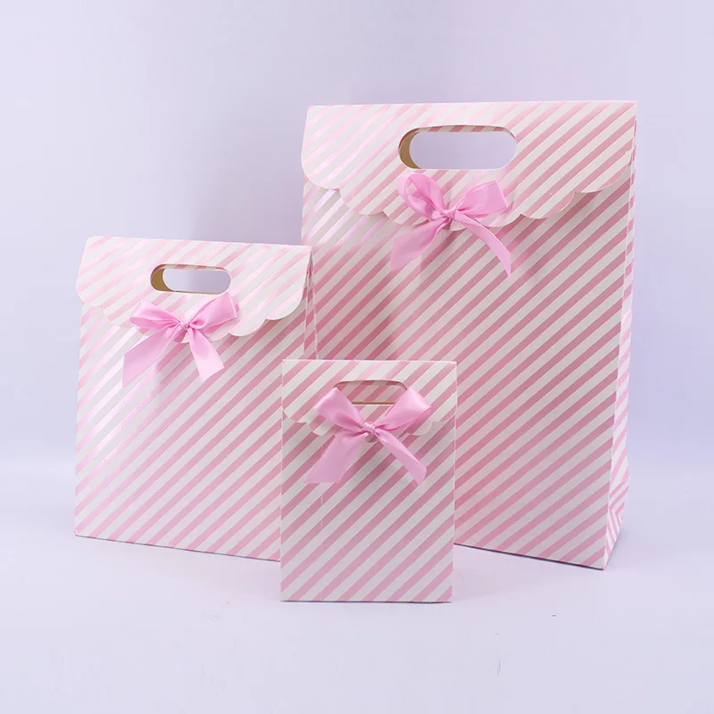 Customize gift bags with bow and company logo