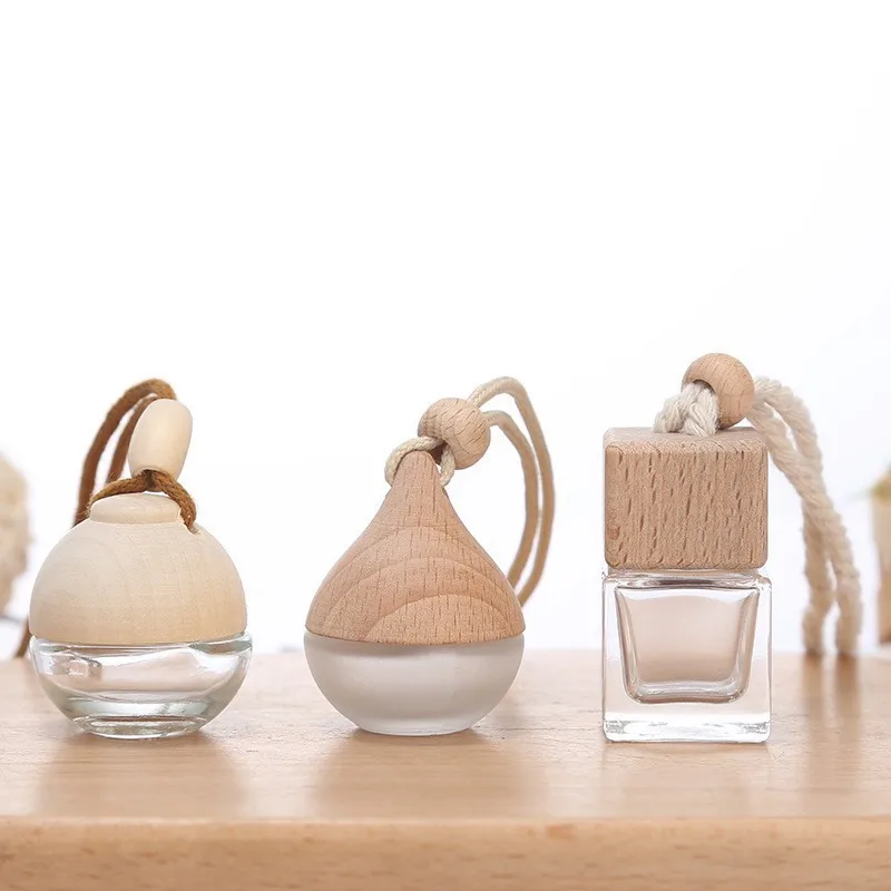 Wholesale 8ml essential oil aroma empty hanging perfume air freshener car diffuser bottle with wood cap car perfume diffuser