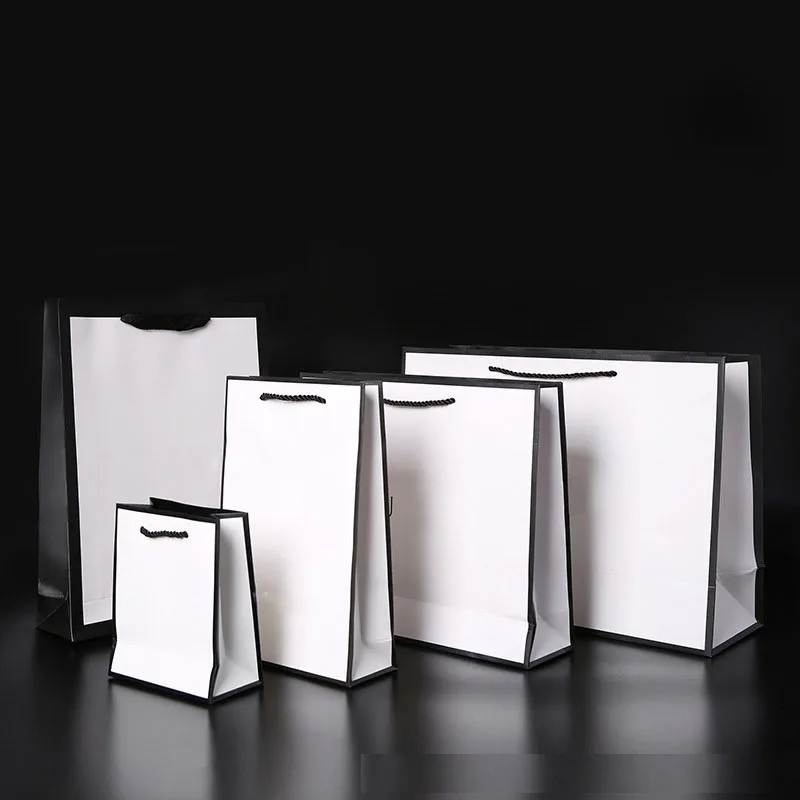 China Manufacturer White Luxury Printed Gift Custom Shopping Paper Bag With Your Own Logo and bowknot