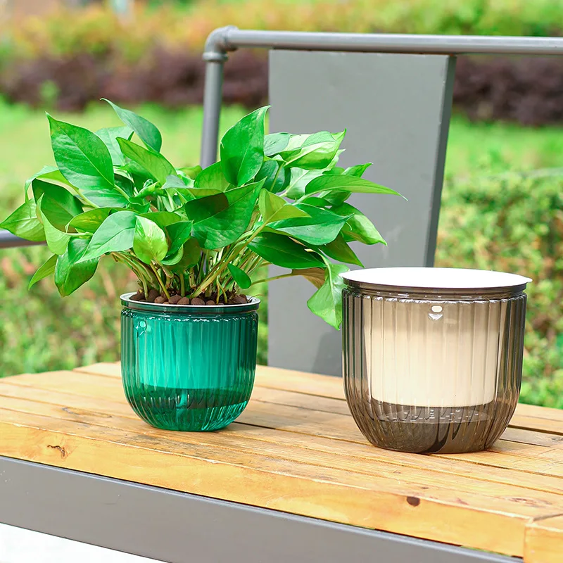 Small transparent self watering home decor plastic flower pot automatic water absorption flower pot
