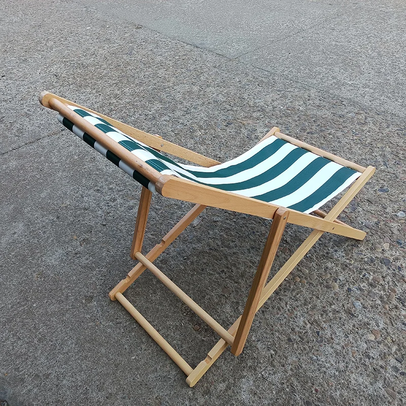 black and white stripe outside lazy rest beach hotel chaise lounge swimming pool wooden sun deck chair