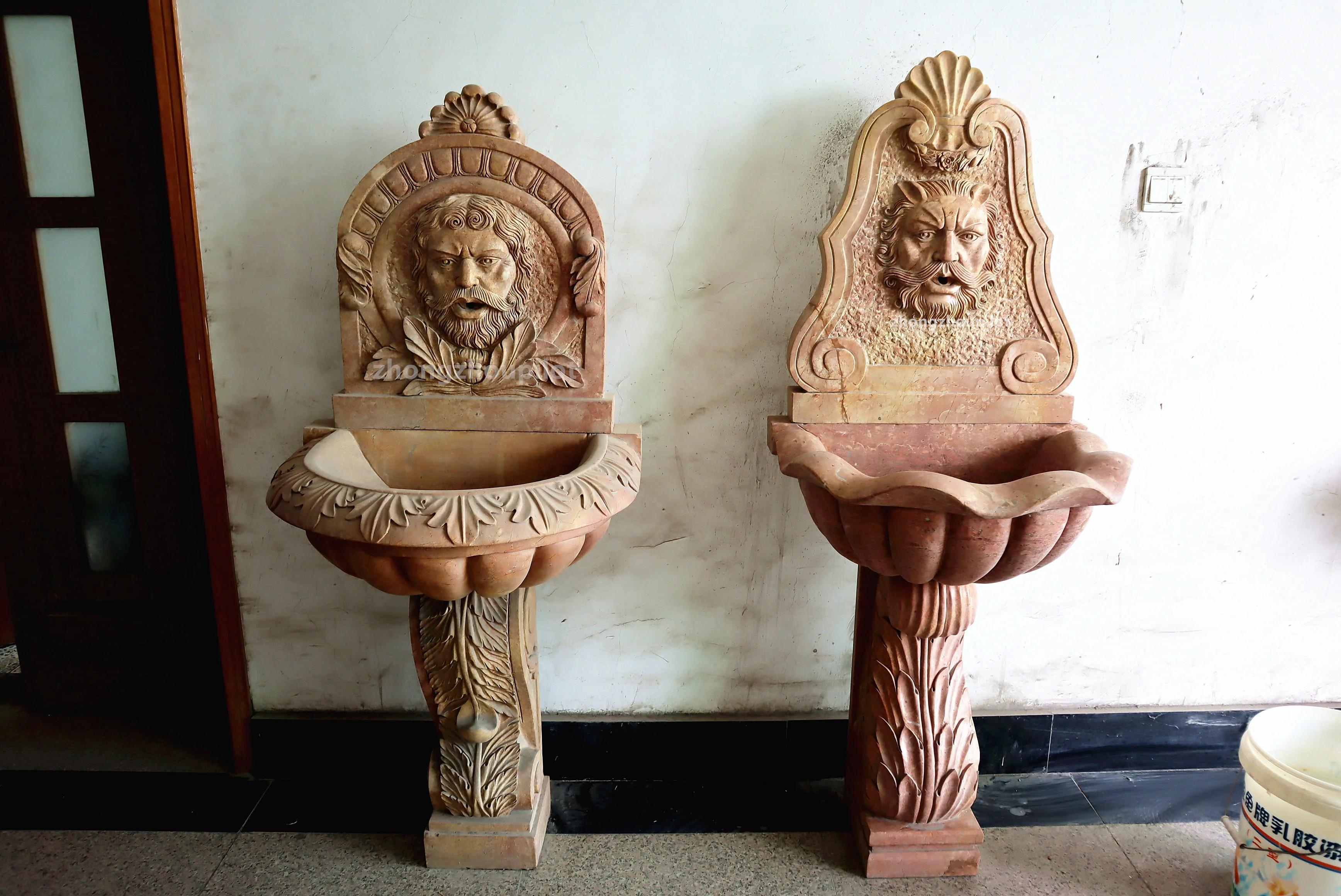 Indoor and outdoor red and beige stone small waterfall wall man head water fountain