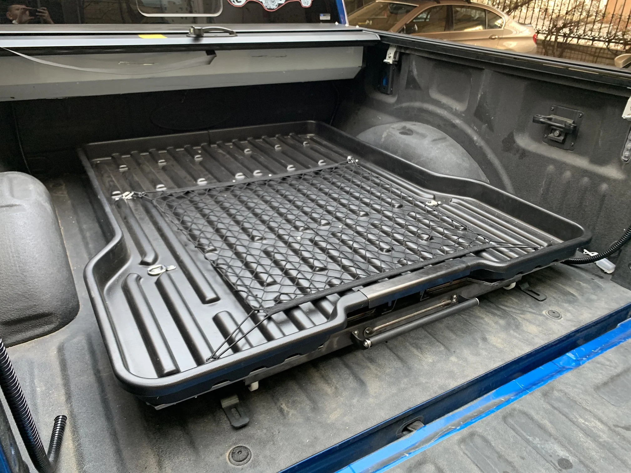 
Slide tray for truck bed liner 