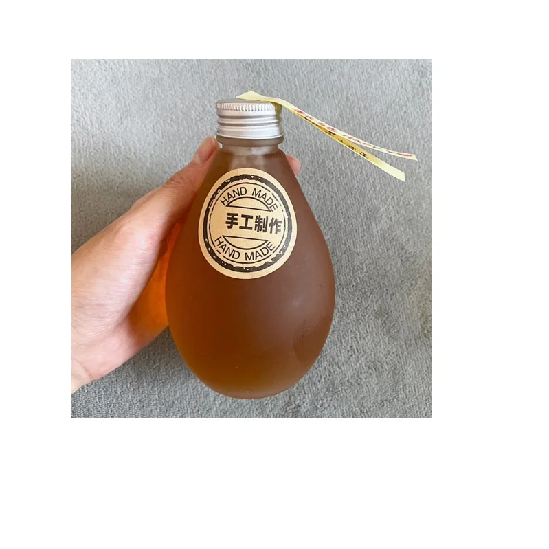 High quality 350ml water drop shape glass bottle for fruit wine/milk tea/coffee/juice with screw cap