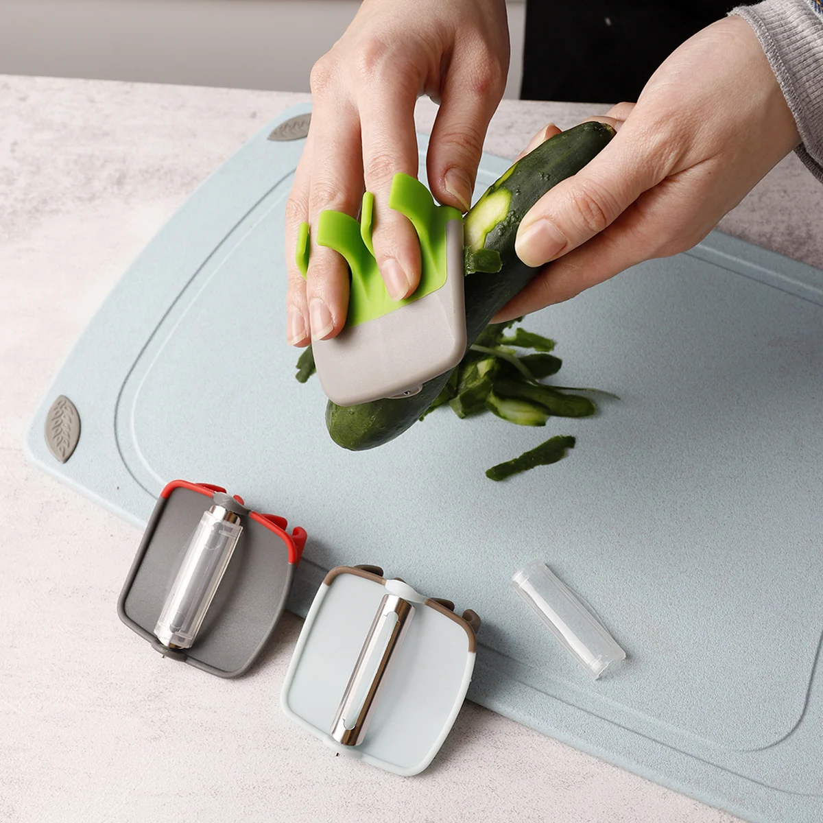 Wholesale multifunctional stainless steel cheese fruit vegetable finger grip manual hand held kitchen mini grater