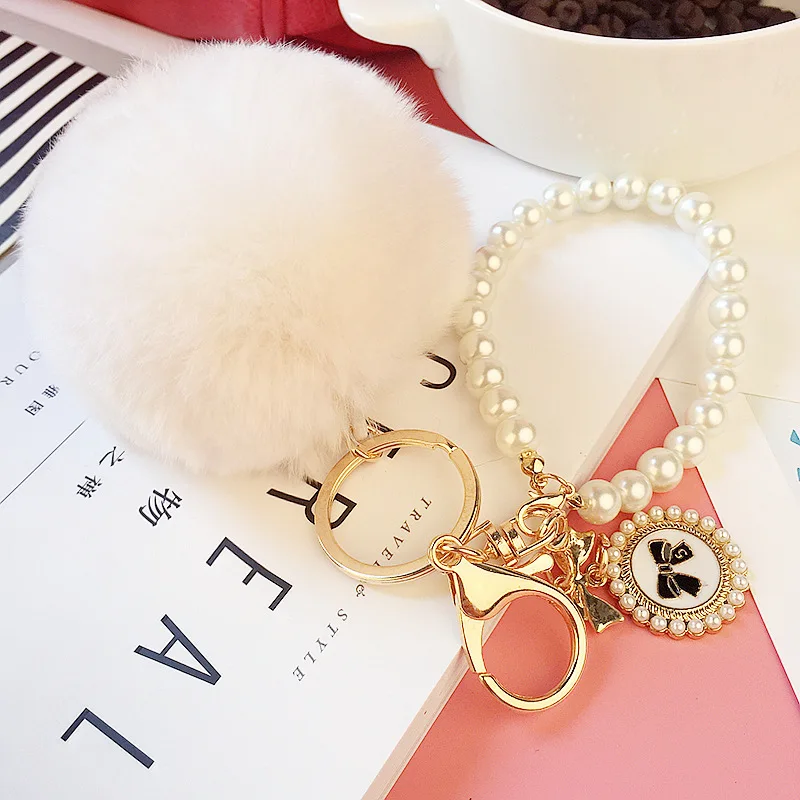 2022 Hot Sale Cheap Promotional Pearl Chain Charm Fluffy Cute 8cm Faux Fur  Key houlde Pompon Fur Ball Pom Keychain