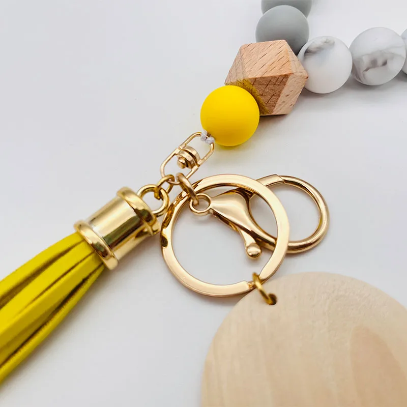 Customized Tassel Silicone Bead Bracelet Keychain Wristlet Elastic Macrame Beautiful Wood Silicone Beaded Monogram Keychain