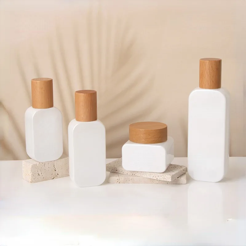 Wholesale cosmetic packaging container frosted skincare set bottle glass face cream jar with bamboo lid