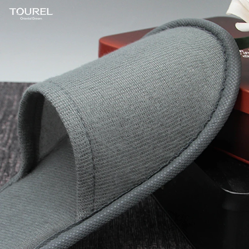 OEM Custom Logo luxury hotel room amenities slippers manufacturer modern design plain nap cloth shoes disposable spa slippers