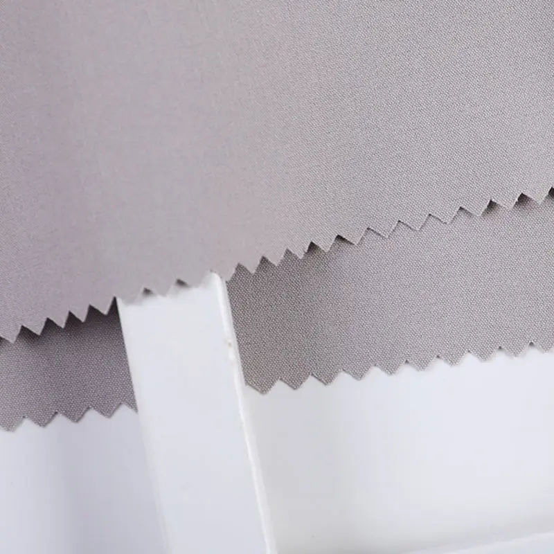 Shaoxing yuyuan imp 100 polyester non spandex chemical fabrics roll woven cloth garment machienical stretch nslycra fabric