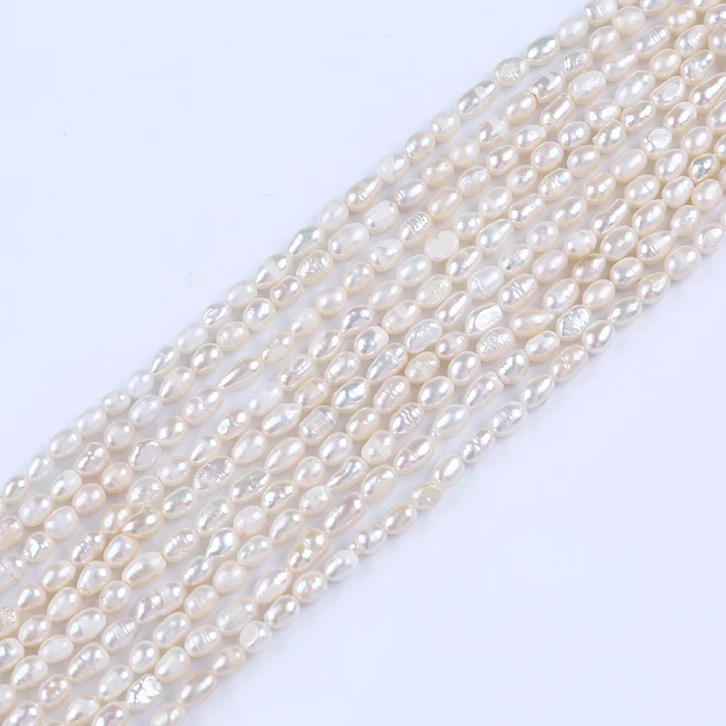 
4 5mm white rice shape freshwater pearl strands cheap beads  (1600115660321)
