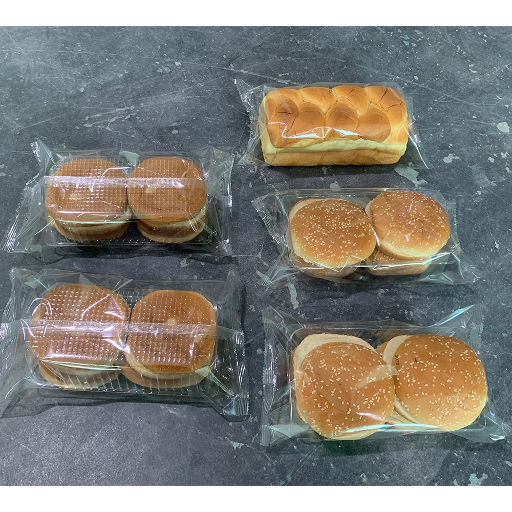 China Semi Automatic Bread Buns Packing Machine Suppliers Flow Pack Chocolate Packaging Machine